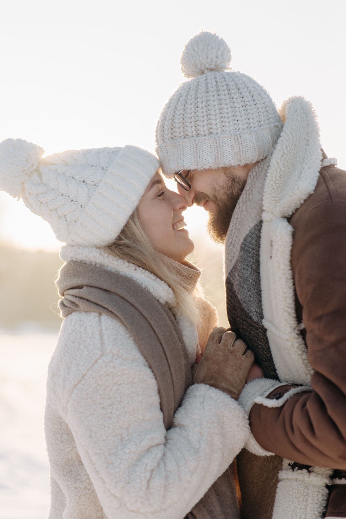 A couple smiling together on a winter day