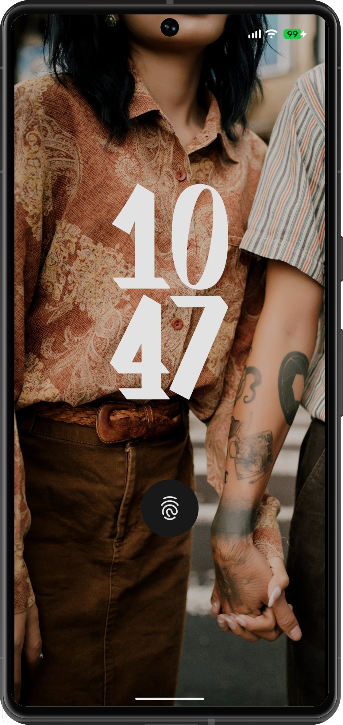 A shared wallpaper synced across both phones
